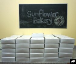 Sunflower Bakery's desserts are boxed and ready to be delivered.