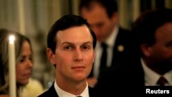 FILE - White House senior adviser Jared Kushner listens as U.S. President Donald Trump speaks at a dinner to honor evangelical leadership in the State Dining Room at the White House in Washington, Aug. 27, 2018.