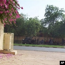 Soldiers stand guard by Niamey's national hospital, Niger, during a coup attempt against President Mamadou Tandja on 18 Feb. 2010