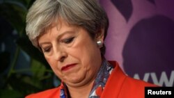 Britain's Prime Minister Theresa May waits for the result of the vote in her constituency at the count center for the general election in Maidenhead, June 9, 2017. 