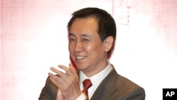 FILE - In this June 12, 2015 photo, Evergrande China founder Xu Jiayin attends a news conference for the Guangzhou Evergrande soccer team in Guangzhou in southern China's Guangdong Province. 