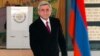 Armenian President Serge Sarkisian casts his ballot during presidential election in Yerevan, Armenia, Feb. 18, 2013.