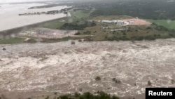 An aerial view shows flooding along Lake Lyndon B. Johnson dam in Llano county, Texas, U.S., Oct. 16, 2018, in this still image from video obtained from social media.