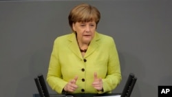 Kanselir Jerman Angela Merkel di parlemen Jerman, Berlin (21/5). (AP/Markus Schreiber) 