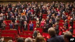 FILE - Lawmakers are seen in France’s lower house of Parliament, in Paris.