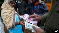 Traders transact at a wholesale vegetable market in Bangalore, India, Dec. 30, 2016.
