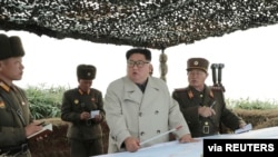 North Korean leader Kim Jong Un visits the Changrindo defensive position on the west front, in this undated picture released by North Korea's Central News Agency (KCNA), Nov. 25, 2019. 