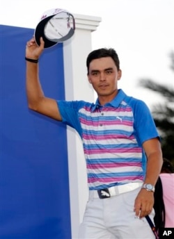 Rickie Fowler is introduced as The Players Championship golf tournament winner Sunday, May 10, 2015 (AP Photo/Lynne Sladky)