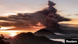 Mount Agung volcano spews smoke and ash in Bali, Indonesia, Nov. 26, 2017.