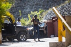 Presidential guards patrol the entrance to the residence of late Haitian President Jovenel Moise in Port-au-Prince, Haiti, July 7, 2021.