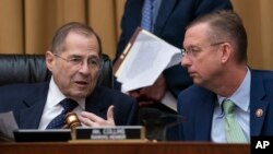 House Judiciary Committee Chair Jerrold Nadler, D-N.Y., left, and Rep. Doug Collins, R-Ga., the ranking member, talk as Nadler moves ahead with a vote to hold Attorney General William Barr in contempt of Congress on May 8, 2019. (AP Photo/J. Scott Applewh