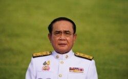 Thailand's Prime Minister Prayuth Chan-ocha attends a family photo session at the Government House in Bangkok, Thailand, March 30, 2021.