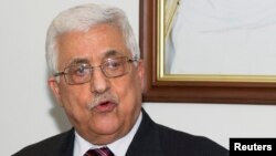 Palestinian President Mahmoud Abbas speaks during a flag-raising ceremony to inaugurate the new Palestinian embassy in Bayan, Kuwait, April 15, 2013. 