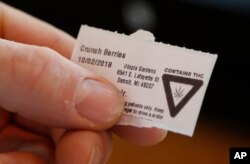 A warning label from Utopia Gardens, a medical marijuana dispensary, is shown in Detroit, Oct. 2, 2018.