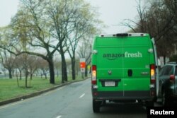 An Amazon Fresh truck makes a delivery in Cambridge, Massachusetts, U.S., April 26, 2017.
