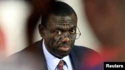 FILE - Kizza Besigye