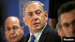 លោក Benjamin Netanyahu នាយករដ្ឋមន្ត្រី​អ៊ីស្រាអែល​នៅ​ក្នុង​កិច្ច​ប្រជុំ​គណៈ​រដ្ឋមន្ត្រី​​នៅ​ក្រុង​ Tel Aviv កាល​ពី​ថ្ងៃ​ទី​៣១ ខែ​កក្កដា ឆ្នាំ​២០១៤។