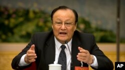 Shohrat Zakir, Gubernur Daerah Otonomi Xinjiang Uighur China, dalam diskusi kelompok di sela-sela Kongres Rakyat Nasional China (NPC) di Aula Besar Rakyat di Beijing, Selasa, 12 Maret 2019.