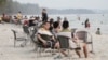 Chinese tourists relaxing at Ochheuteal Beach in Sihanoukville province, Cambodia, February 13, 2019. (Aun Chhengpor/VOA Khmer)
