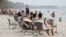Chinese tourists relaxing at Ochheuteal Beach in Sihanoukville province, Cambodia, February 13, 2019. (Aun Chhengpor/VOA Khmer)