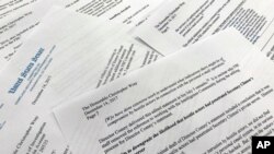 Parts of a letter written by Sen. Ron Johnson, R-Wis., to FBI Director Christopher Wray are shown in a photograph, in Washington, Dec. 14, 2017. Johnson says edits to a draft FBI statement on the Hillary Clinton email investigation appear to have watered down the significance of the bureau's findings. 