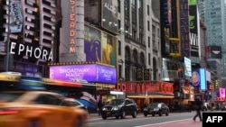 FILE - A view of Broadway theaters on 42nd Street seen on March 12, 2020 in New York City. (Photo by Angela Weiss / AFP)