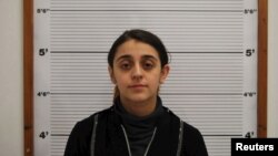 Tareena Shakil is seen after her arrest, in this undated booking picture courtesy of West Midlands Police. 