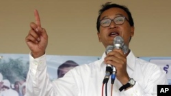 Sam Rainsy, leader of Cambodia's opposition Sam Rainsy Party, speaks during a campaign rally in Kandal province in 2008.