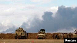 Un site pétrolier incendié près de Tikrit (Reuters)