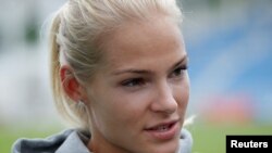 Darya Klishina talks to the media after competing the women's long jump in Zhukovsky, Russia, June 6, 2016.