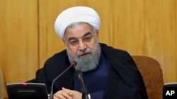 In this photo released by official website of the office of the Iranian presidency, President Hassan Rouhani speaks during a cabinet meeting in Tehran, Iran, July 19, 2017. 