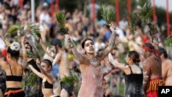 FILE - An Aboriginal dance troupe performs at Australia Day celebrations in Sydney, Australia, Jan. 26, 2020. Rap music has been employed as part of a new awareness campaign to educate Australia's Indigenous about the coronavirus.