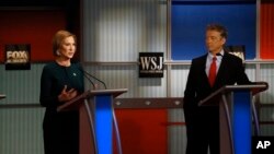 FILE - Carly Fiorina speaks as Rand Paul listens during the Republican presidential debate at the Milwaukee Theatre, Nov. 11, 2015, in Milwaukee, Wisconsin.