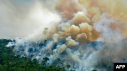FILE - In this file photo taken on August 16, 2020, aerial view of a burning area of Amazon rainforest reserve, south of Novo Progresso in Para state, Brazil. 