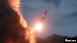 FILE - North Korea test fires a new weapon, in this undated photo released Aug. 11, 2019, by North Korea's Korean Central News Agency (KCNA). 