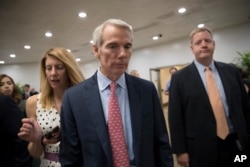 Senator Rob Portman (center) at the U.S. Capitol.
