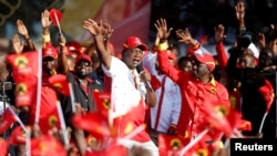 FILE - Kenya's President Uhuru Kenyatta addresses supporters during the last Jubilee Party campaign rally ahead of the August 8th election in Nakuru, Kenya, Aug. 5, 2017. 