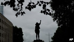 A view of the black resin and steel statue entitled 'A Surge of Power (Jen Reid) 2020' erected early July 15, 2020, in Bristol, England.
