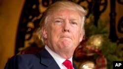 President-elect Donald Trump takes a question from a member of the media at Mar-a-Lago, in Palm Beach, Florida, Dec. 21, 2016.