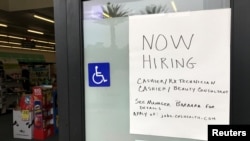 A handwritten hiring sign is posted outside a local drugstore in Solana Beach, California, U.S., July 17, 2017.