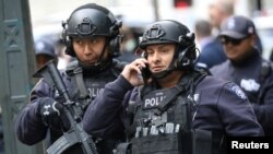 Members of the New York Police Department are pictured outside the Time Warner Center in the Manhattan borough of New York City after a suspicious package was found inside the CNN Headquarters in New York, Oct. 24, 2018. 