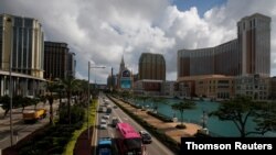 FILE - Traffic flows past gaming resorts at Cotai Strip in Macau, May 15, 2018. 