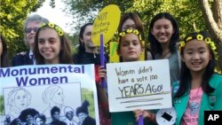 NYC No Womens Statues: In this Oct. 6, 2016 photo, front row, from left, three Girl Scouts: Lila Steinhardt, Sophia Singh, Pippa Lee, and back row, from left: statue project organizer Pam Elam; Skye Lucas and Jackie Hahn from Manhattan`s Dwight School; and Ariel Deutsch from Manhattan`s LaGuardia High School gather in Central Park to raise money for a Central Park monument to women in New York. In Central Park, none of the sculptures or busts honoring illustrious people is a woman. Now, activists are raising money to erect the park’s first monument to women who changed history: suffragettes Elizabeth Cady Stanton and Susan B. Anthony. 