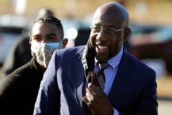 Democrat Rev. Raphael Warnock arrives at a campaign rally in Augusta, Georgia, January 4, 2021.