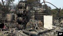 Damage to winemaking vats and barrels at the production house of Paradise Ridge Winery from a wildfire are seen, Oct. 10, 2017, in Santa Rosa, California.