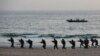 FILE - Pakistan Navy's special service group conduct a maritime counter-terrorism demo during an exercise in Karachi, Pakistan February 9, 2019.