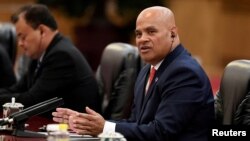 FILE - Micronesia's President David Panuelo talks with China's President Xi Jinping (not pictured) at the Great Hall of the People in Beijing, China, Dec. 13, 2019. Panuelo is alleging that Chinese agents followed him during a recent trip to Fiji.