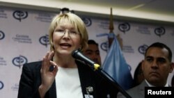 FILE - Venezuela's chief prosecutor Luisa Ortega Diaz talks to the media during a news conference in Caracas, Venezuela, May 24, 2017. 