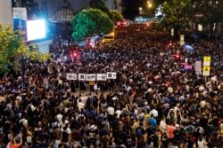 Civil servants attend a rally to support the anti-extradition bill protest in Hong Kong, Aug. 2, 2019.