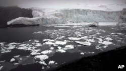 Melting blocks of ice float near the Pastoruri glacier in Huaraz, Peru, Dec. 4, 2014.